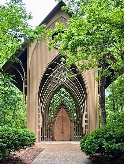 Mildred B. Cooper Chapel surrounded by trees in Bella Vista